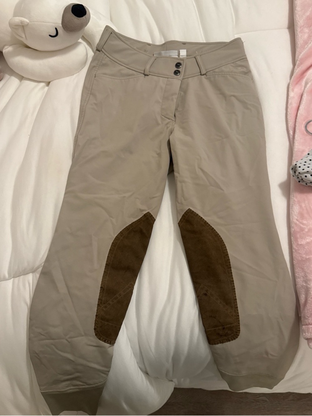 Classic beige riding breeches with brown logo detail
